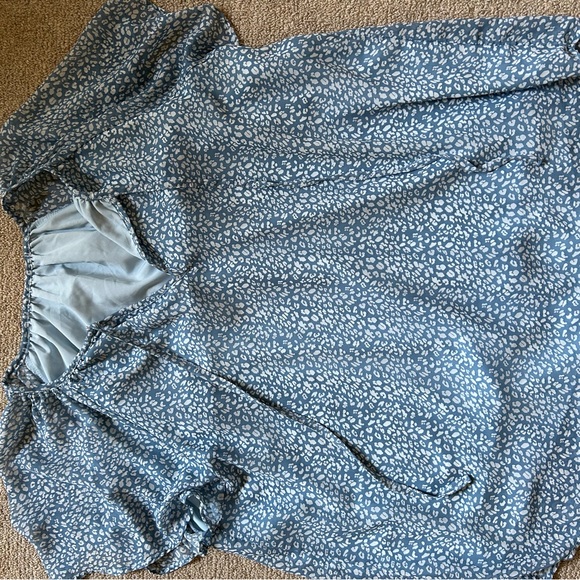 Polyester, blue & white blouse with two strings in the front. Flowy & runs big - Picture 3 of 3